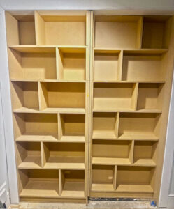 Trim carpentry with built in cabinets