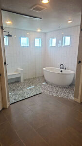 Custom bathroom tile work, shower glass installation, shower pan, plumbing work, tub and faucet installation