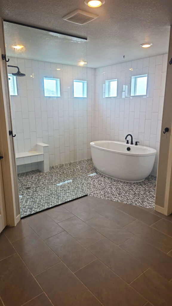 Custom bathroom tile work, shower glass installation, shower pan, plumbing work, tub and faucet installation